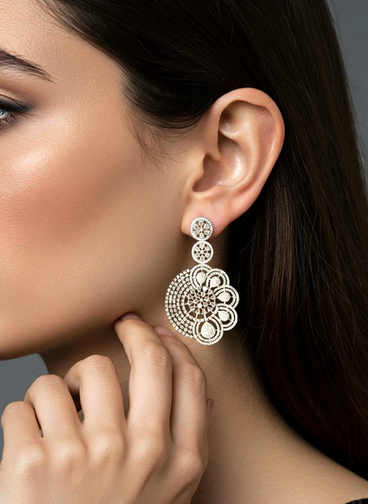 Close-up of a woman wearing an ornate earring with a dark background